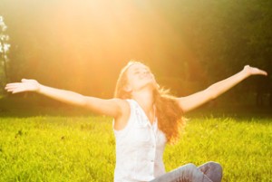 Girl raising arms in meditation